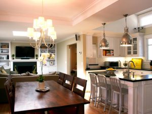 Merging the dining and sitting rooms is the best option for a middle-income individual intending to build a home