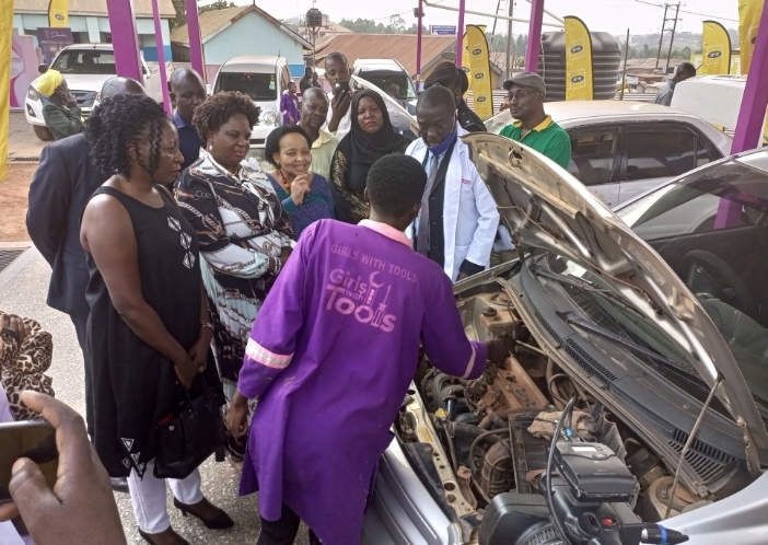 Minister Amongi and the South African High Commissioner listen to a trainee at the facility