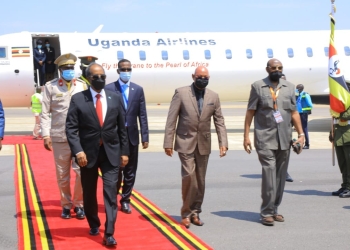 Somalia President Hassan Sheikh Mohamud and Uganda's Foreign Affairs Minister Gen Jeje Odongo. Somalia President used flew into the country using Uganda Airlines (PHOTO /Courtesy)
