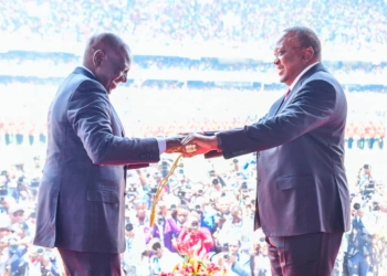 Former President Uhuru Kenyatta hands over the ceremonial military sword to President William Ruto. PHOTO| COURTESY