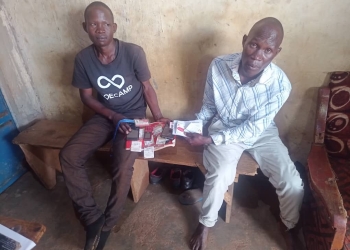 The suspects, identified as Mujasi Denis, and Maganda Alex were intercepted after one of the Airtel customers in Iganga tipped off the Police to arrest them. The two had fake Airtel staff identity cards, which they used to disguise and defraud customers.
