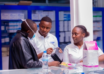 Alex Musyoka, VIEBEG Co-founder and Chief Commercial Officer (centre), explaining to a customer the importance of being a data-driven healthcare provider.