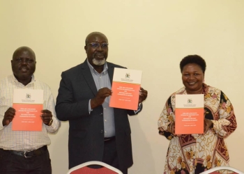 Minister of State for Labour, Charles Engola (C), the Assistant Commissioner Stephen Koma and Gulu RCC, Jane Frances Amongin launching the plan in Gulu on Thursday (PHOTO/Courtesy)