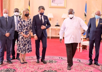 New Danish Ambassador, Signe Winding Albjerg (in dress) with President Museveni (R)