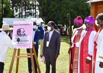 President Museveni launches a book on Bishop Hannington as Bishops look on during Bishop Hannington Day in Mayuge on Saturday (PHOTO/PPU)