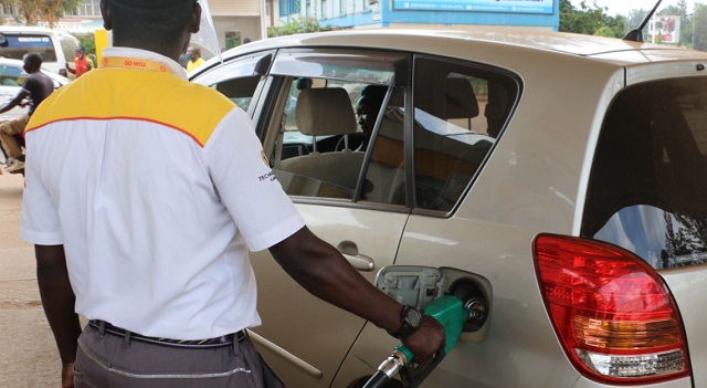 A man fuel a car at a station in Kampala. (PHOTO/Courtesy)