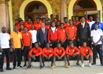 Ambassador Ssemuddu sharing a light moment with the Uganda -U20 national team in Khartoum