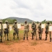 Col JB Asinguza (C), the Director of Training in SFC inspects the targets shot by the soldiers during a passout at Kaweweta on Wednesday upon finishing their Tier II Course. (PHOTO/ PPU)