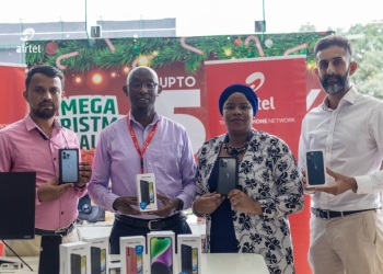 David Birungi (2nd L), Public Relations Manager at Airtel Uganda, Joweria Nabakka, (2nd R), Head Data, and New Product Development at Airtel Uganda, and Amar M Thakrar (L) Managing Director of Transtel Uganda pose for a photo during the partnership announcement in Kampala yesterday