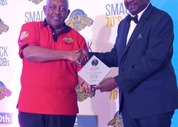MTN Uganda Chairman Charles Mbire awards Prof. Kaleebo who is the Director of Uganda Virus Research Institute ( UVRI)