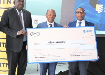 Dr. John Chrysostom Muyingo, the State Minister for Higher Education (Centre Front) and MTN Foundation Senior Manager, Bryan Mbassa (4L) and other officials from the MOES and the Uganda Institute of Information and Communications Technology launches the ULEARN platform on 25 January 2023