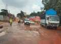 Vehicles navigate potholes along Sir Apolo Kaggwa road. URN photo