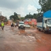 Vehicles navigate potholes along Sir Apolo Kaggwa road. URN photo