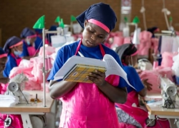 An AFRIpads employee at work in Masaka, Uganda. Photo by: Ed Ram Photography Flexible working hours can benefit productivity, work-life balance: ILO report