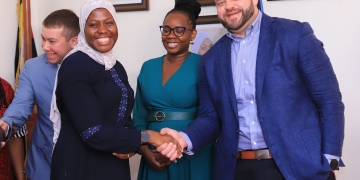 (L-) Ministry of ICT Permanent Secretary, Dr. Amina Zawedde, Helpware General Manager, Africa, Angella Kitandwe and Helpware CEO Robert Nash share a light moment ahead of the company launch at the Makerere University on Feb.10.