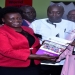 Nakadama (R) receives a copy of the UWOPA strategic plan from Opendi