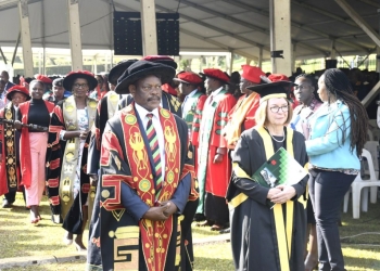 The Vice Chancellor, Prof. Barnabas Nawangwe (2nd R) and Vice-Chancellor University of London, Prof. Wendy Thomson (R) with members of the University leadership as the Procession makes its way through the Freedom Square on Day 1 of the 73rd Graduation Ceremony on 13th February 2022.