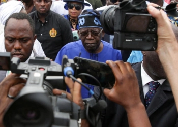 Bola Ahmed Tinubu arrives at a polling station before casting his ballot in Ikeja, Lagos, Nigeria on February 25, 2023.