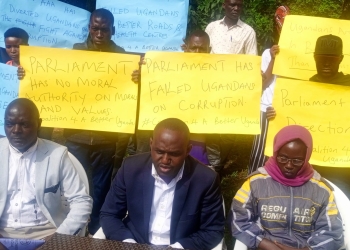Akampa Tanbull (L) coordinator Youth Coalition 4 a Better Uganda and Generous Kasanda, a youth leader of National Resistance Movement (NRM) during a press conference at Makerere University Guest House compound in Kampala on Friday March 24 (PHOTO/UG Standard)
