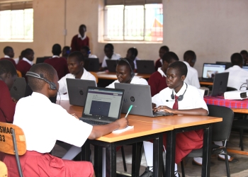 Pupils at St. Mary Asumpta Girls Secondary School Pekelle in Adjumani district attend a biology lesson online during the launch of the UNICEF and Airtel Africa partnership. The partnership launched on March 20, 2023 aims at accelerating quality and equitable digital learning in Uganda (PHOTO/ MARIA WAMALA)