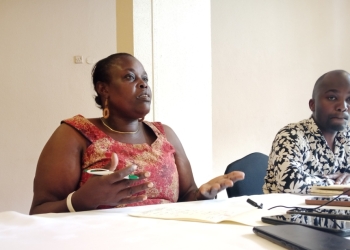 Akisa Harriet the Deputy in charge of AIDO Network Uganda addressing the press on Friday in Kampala