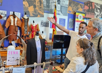 Third Secretary, Phillip Luzzi explains Barkcloth making to visitors
