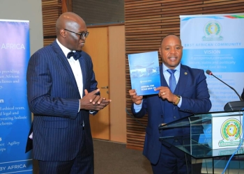 EACJ President Judge Nestor Kayobera with CEPIL’s Francis Gimara (Courtesy photo)