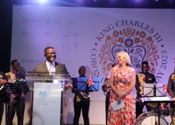 Katikkiro Charles Peter Mayiga delivers his speech at the Kings Coronation reception as Kate Airey, British High Commissioner looks on in Kampala