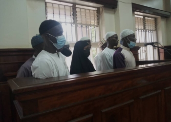 The nine accused persons in court on Mon