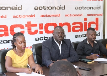 Action Aid International Uganda Country Director Francis Xavier Ejoyi and partners addressing the press in Kampala.