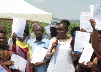 The minister, while handing over freehold land titles to beneficiaries in Rwampara in Bushenyi Village, Rugando Sub-County on July 7 advised the new landlords to register their land into a trustee person agreed upon by the family such that they curb conflicts and people who may want to sell off their land.