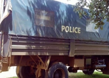 Police truck that was intercepted while loading bags of charcoal at Kamusalaba village