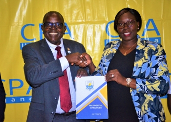 Outgoing President CPA Constant Othieno Mayende hands over power to the new president, CPA Josephine Okui Ossiya