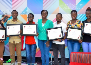 ATC Uganda CEO Dorothy K. Ssemanda (middle) awarded the first cohort of
Industrial trainees with certificates of completion after 12 months of
the Industrial Training Program. The initiative identifies and provides
young talent with professional training to enhance their skills and
employability in various fields.