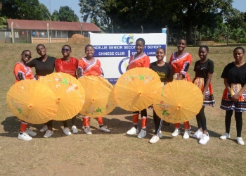 Students pose for a photo during the launch ceremony of the Chinese Club at Ndejje Senior Secondary School in Luwero, Uganda, on July 21, 2023. (Photo by Nicholas Kajoba/Xinhua)