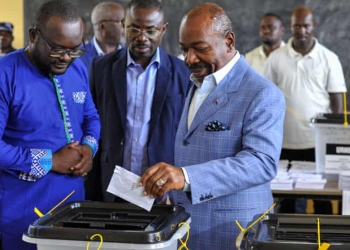 Televised announcement comes after electoral authorities said presidential incumbent had won third term in office