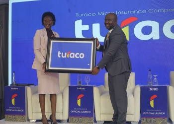 DEAL INKED – Hon Evelyn Anite (State Minister for Investment & Privatization) holds plaque with Turaco Insurance GM Hamza Mutebi after Turaco officially became an insurance underwriter in Uganda.