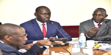Committee Chairperson, Hon. Gilbert Olanya (C) with his deputy, Hon. Luttamaguzi Semakula as they interacted with the Mpigi officials led by the district chairperson, Martin Ssejjemba