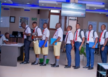 Stanbic Bank staff wore school uniform in Solidarity with parents as they prepare to take children back to school next week.