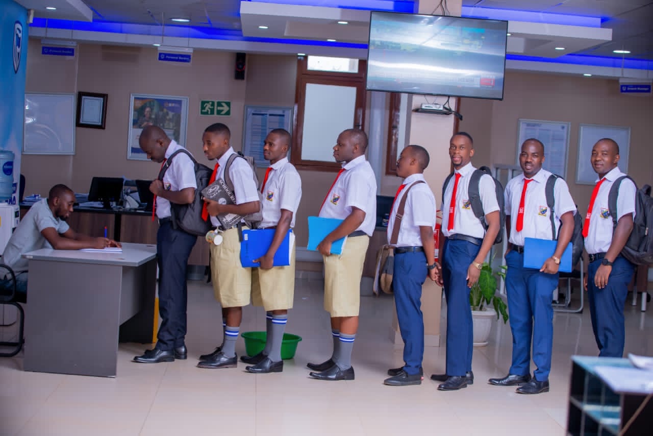 Stanbic Bank staff wore school uniform in Solidarity with parents as they prepare to take children back to school next week.