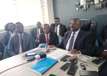 Mwesigwa Rukutana with other lawyers representing the applicants addressing the press in Kampala on Tuesday.