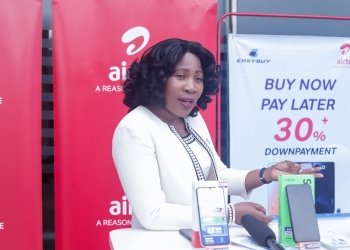Carol Asio, Head of Retail at Airtel Uganda addressing the media at the Airtel Uganda and EASYBUY partnership launch at the Kingdom Kampala Airtel Shop