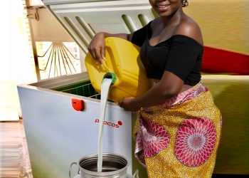 Nyangabyaki Justice a diary farmer from Rusheere using a solar powered fridge (PHOTO/Courtesy)