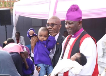 Archbishop Kazimba Mugalu with some of the children from Sanyu Babies Home (Courtesy photo)