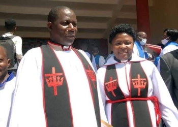 Ven. Canon Moses Banja (left)