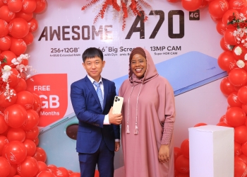 The Head Data, Devices at Airtel Uganda, Joweria Nabbaka (L), itel country manager, Mr. Martin Yan(R) unveiling the New Itel A70 to boost connectivity and access to opportunities of the smartphone in Uganda. The event was held today at Sheraton Four Points in Kampala