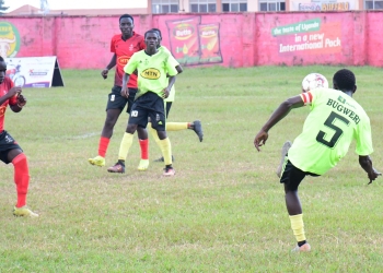 Bugweri FC's Ismail Kagere (right) taking a shot as his team was playing against Butembe FC during the first quarter final of the MTN Busoga Masaza Cup tournament at Kyabazinga stadium in Bugembe, Jinja City on Dec