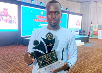 DAVID OKEMA, WHO HEADS THE ACHOLI REGION BUREAU FOR DAILYEXPRESS WITH HIS ACCOLADE AWARDED TO HIM BY THE NATIONAL POPULATION COUNCIL FOR BEST ONLINE STORY 2023 (PHOTO/DAILYEXPRESS