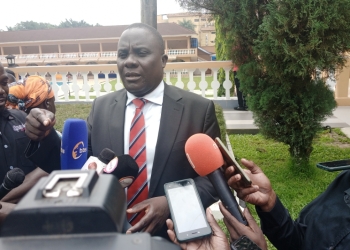 Hon Muwanga Kivumbi addressing the press at the Symposium