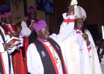 Archbishop of the Church of Uganda, Stephen Kaziimba Mugalu officially shows off the 6th Bishop off the sixth bishop of Namirembe Diocese, the Rt. Rev. Moses Banja at St. Paul's Cathedral Namirembe during the enthronement and consecration service.